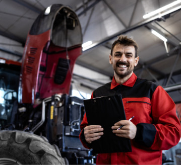 Heavy equipment technician using the STX Garage app to work on machines