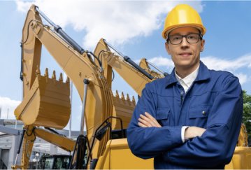 Equipment owner in front of machines